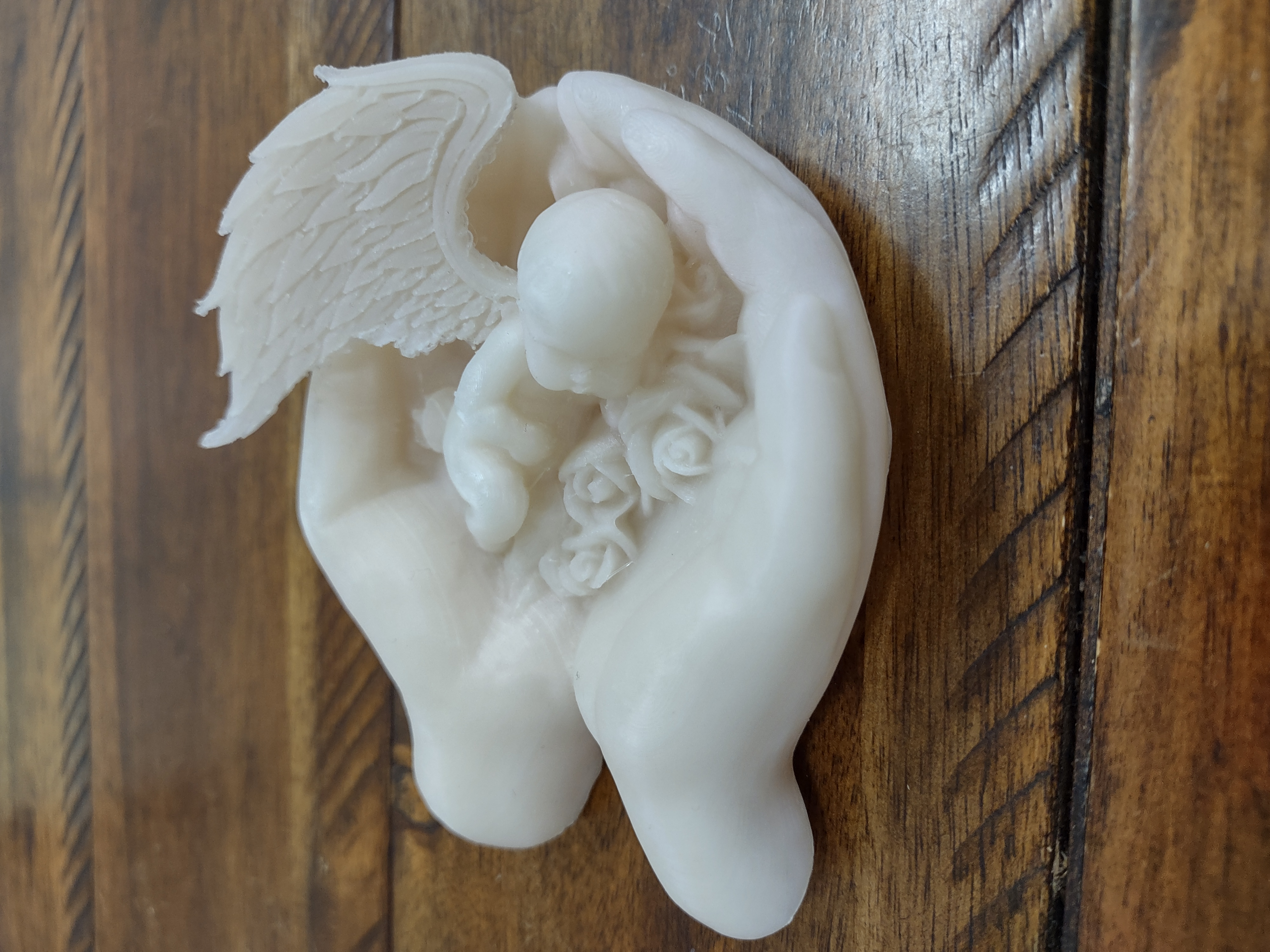 Hand holding Baby Angel 